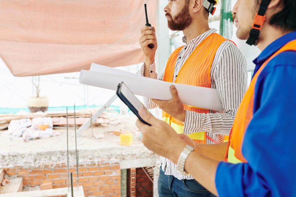 Civil engineer talking on walkie-talkie